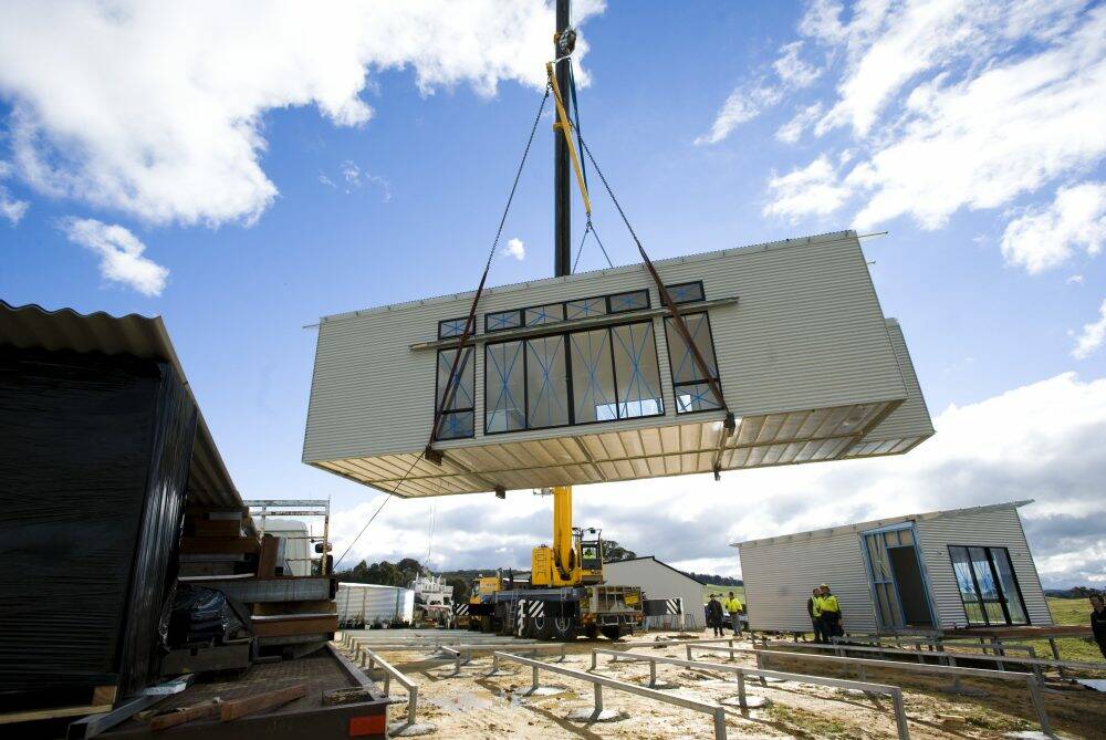 A section of the home is lowered into position. Photo: Elesa Kurtz