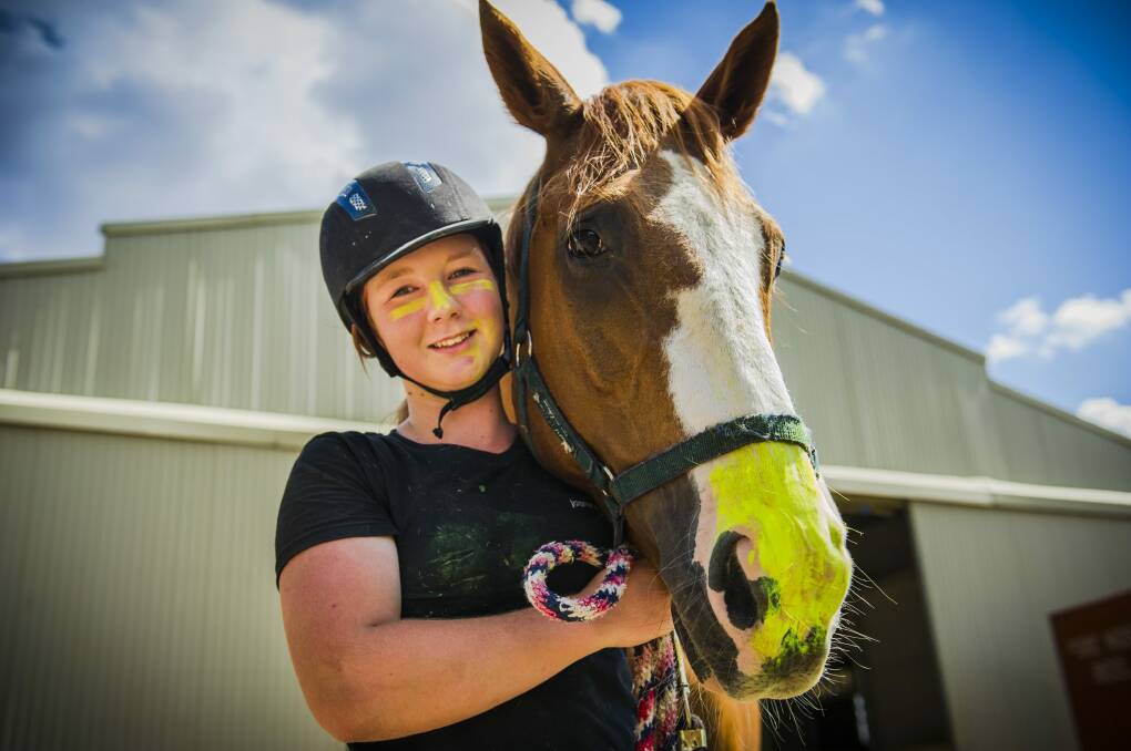 Heat cheaters: Flynn, a horse at the National Equestrian Centre, and his rider Jasmine Allday, 15, wear zinc on their noses as protection from the hot summer sun. Photo: Jamila Toderas