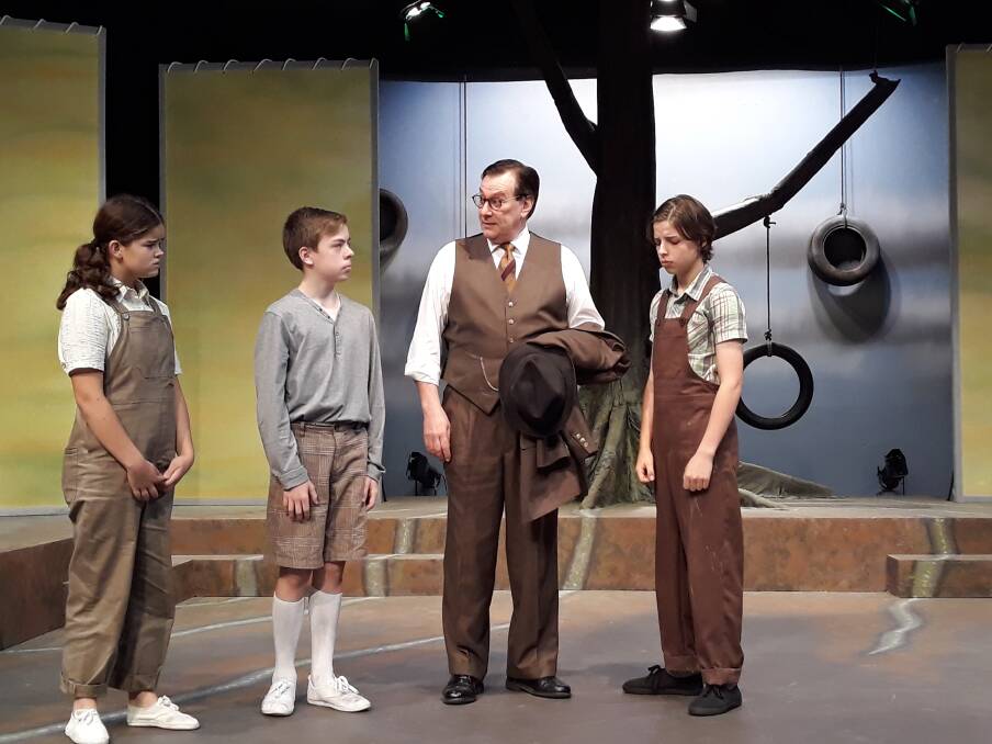 Jade Breen (Scout), Jake Keen (Dill), Michael Sparks (Atticus) and Jamie Boy (Jem) on the set of To Kill a Mockingbird at Theatre 3. Photo: Megan Doherty