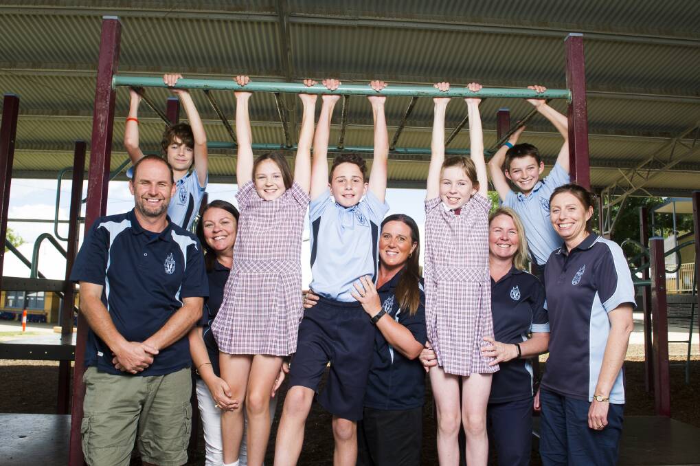 (From left) Ben Sweeney, Rhys Sweeney, Katherine Austin, Amelia Austin, Nathaniel Mowlam, Tracy Mowlam, Lindsay McArthur, Annie McArthur, Hayden Breen and Belinda Breen at St Clares of Assisi Primary School.  Photo:  Dion Georgopoulos