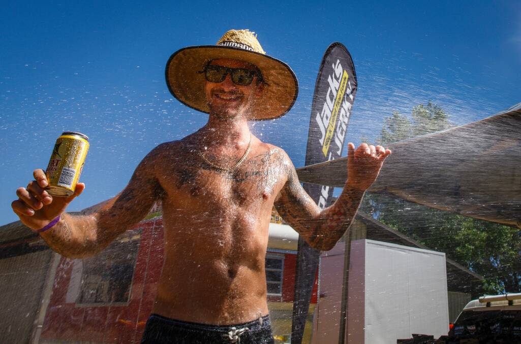 Chris Barac from Bonython is hosed down during the heat of the day at Summernats.  Photo: Sitthixay Ditthavong