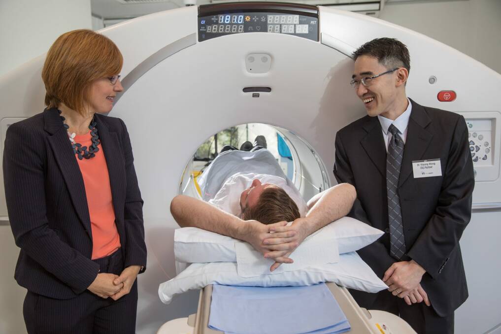 ACT Minister for Health Meegan Fitzharris with CIG radiologist, Will Cole acting as a patient and CIG PET/CT medical specialist Dr Yiisong Wong. Ms Fitzharris will launch a new framework for ACT Health on Monday.  Photo: Andrew Taylor