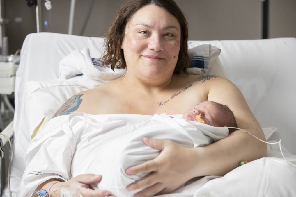 Cassie Woods pictured with her newborn son, Declan Woods Photo: Sitthixay Ditthavong