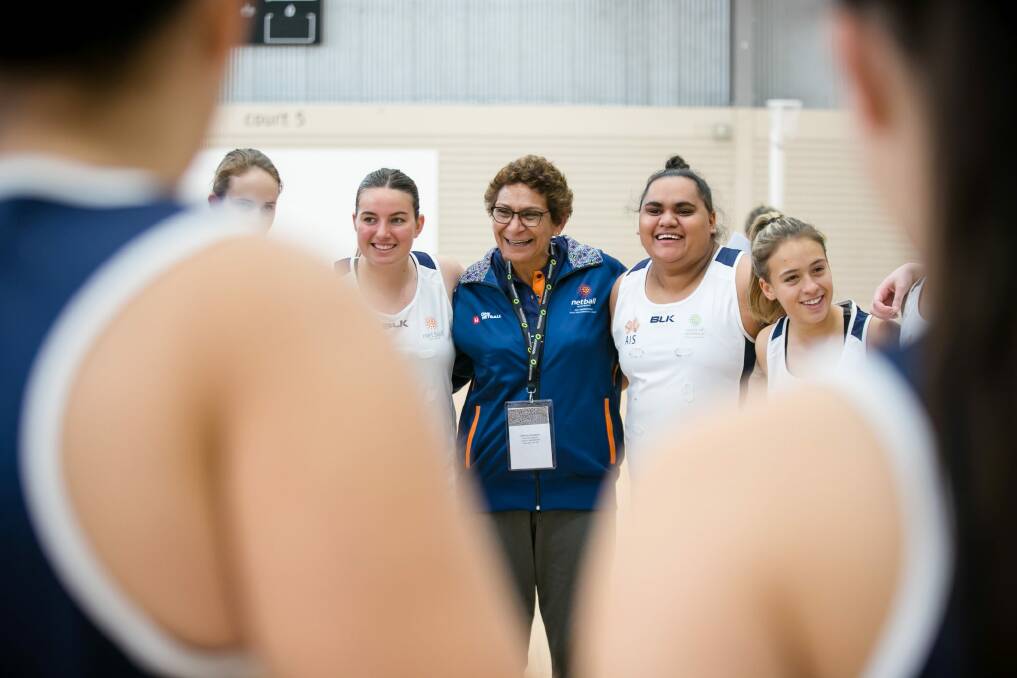Marcia Ella-Duncan with players at an Indigenous netball high performance camp. Photo: narelle spangher
