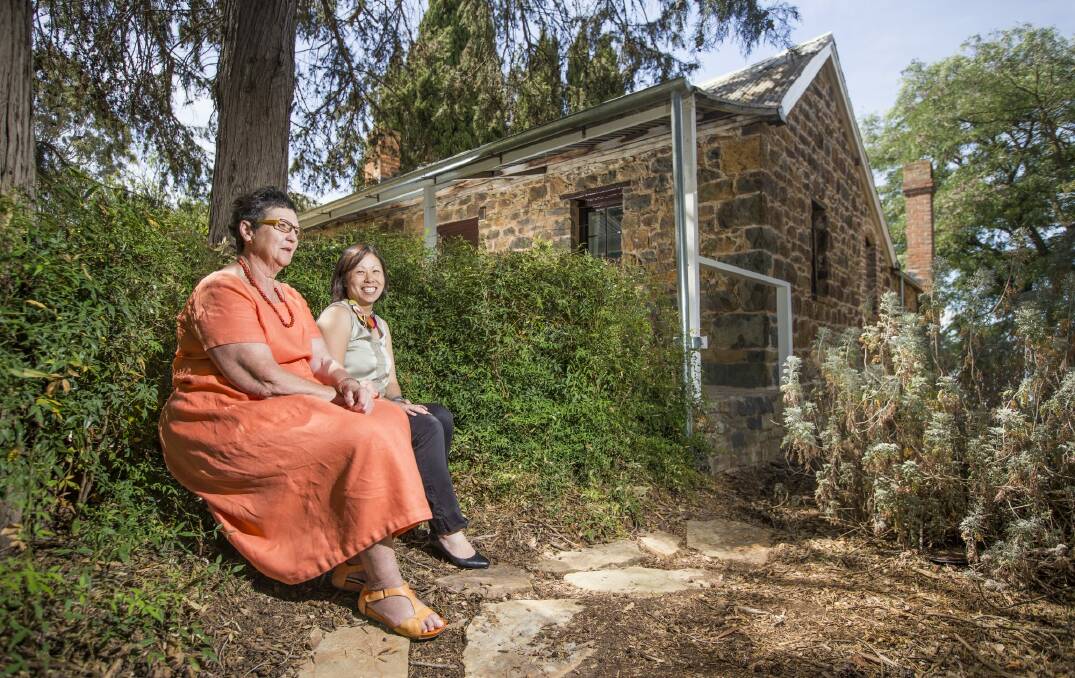 National Capital Authority strategic marketing manager Pam Owen and National Capital Authority heritage manager Anna Wong at Blundells Cottage in Parkes.  Photo: Matt Bedford