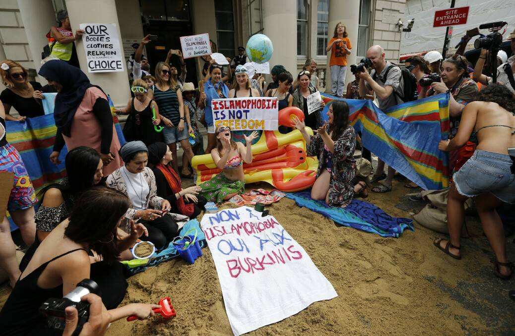 Activists protest the burkini ban outside the French embassy in London. Photo: AP