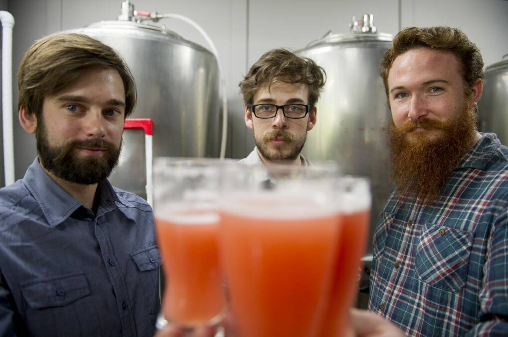 Kevin Hingston, Frazer Brown and Alan Ball with their new brew -'I'm Tracey Grimshaw and this is A Current Affair'. Photo: Jay Cronan