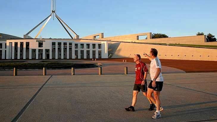 Queensland Premier Campbell Newman and Prime Minister Tony Abbott return to Parliament House after an early morning run around Lake Burley Griffin. Photo: Alex Ellinghausen