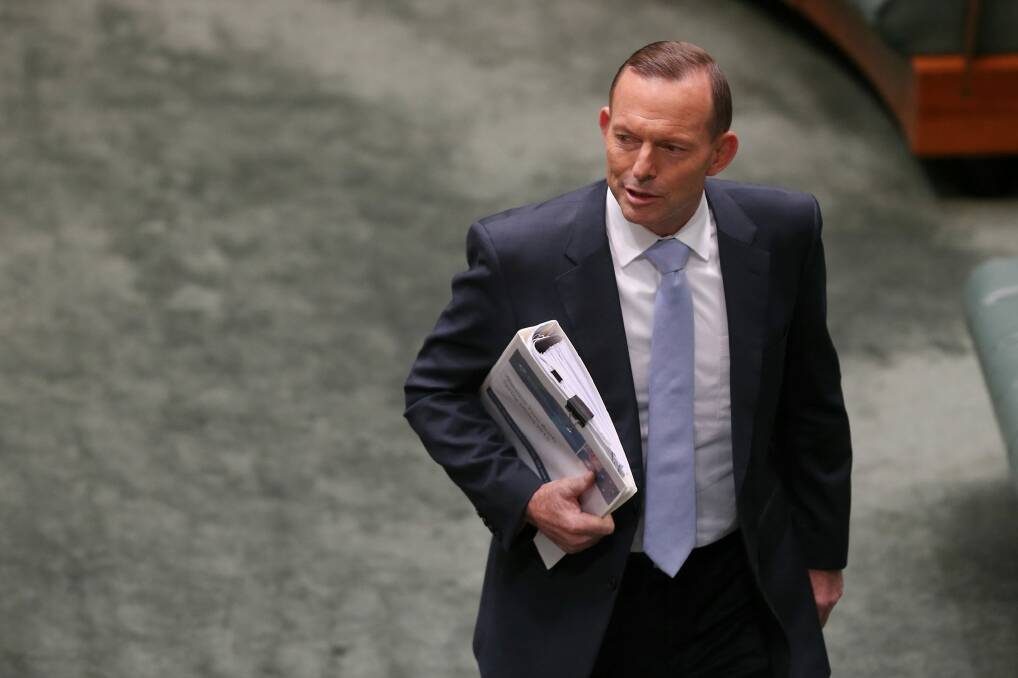Prime Minister Tony Abbott arrives for Question Time. Photo: Alex Ellinghausen