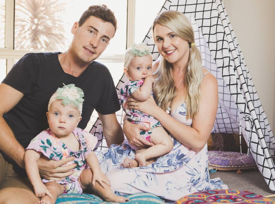 Luke and Teri Greenhalgh at home in Canberra with their twins Dahli and India, who were born premature but are now thriving. Photo: Jamila Toderas