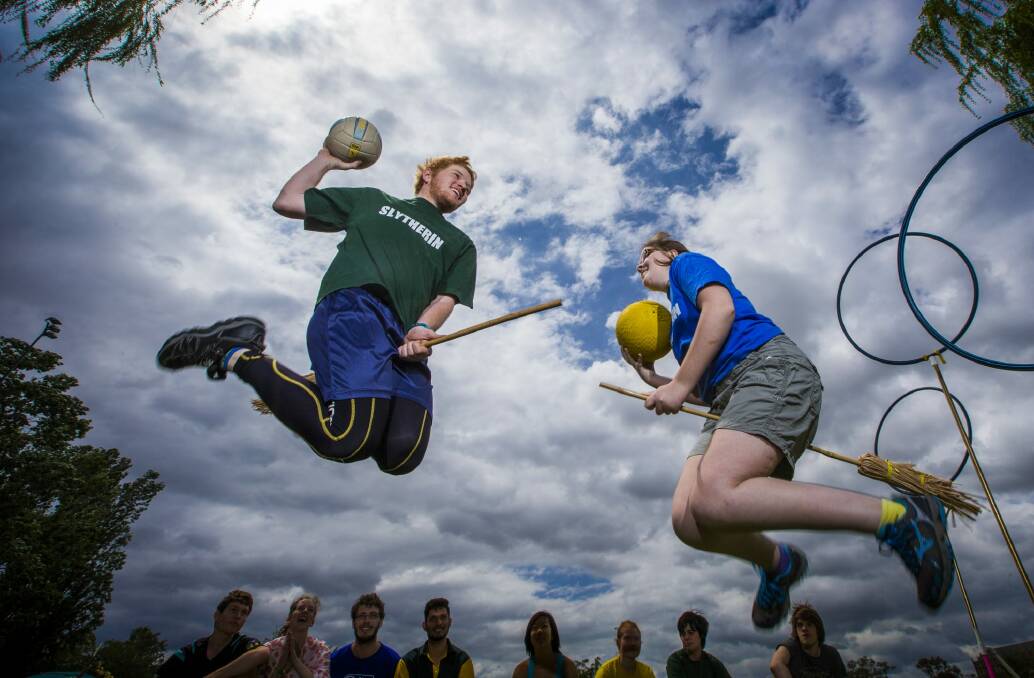 
Bewitched brethren: Slytherin player Matthew Armstrong and Ravenclaw Team Captain Holly Mansfield in full flight at the Australian National University's Harry Potter Society Quidditch Cup grand final.  Photo: Matt Bedford