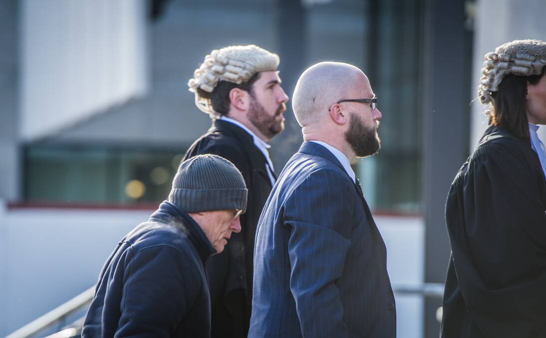 David Eastman, left, arrives at the ACT Supreme Court with his lawyers for the first day of his trial.  Photo: Karleen Minney