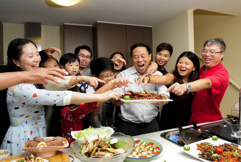 Celebrating the Chinese New Year are, from left, Li Deng, of Ngunnawal, Steven Wang, 3, of Ngunnawal, Zhiyu Wang, of Ngunnawal, Kevin Wei,12, of Nicholls, Jianxin Wei, of Melba, Siyuan Wei,19, of Nicholls, Xiang Lei, of Nicholls, and Hongxin Wei, of Nicholls.  Photo: Melissa Adams