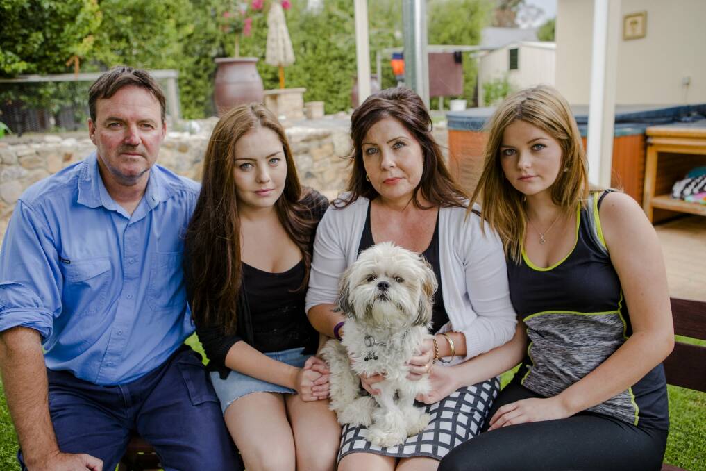 The Downes family's dog Bailey just scraped through after toxic poisoning. 
from left, Dean, Jessica 19, Leah, Kristen 17, and Bailey the shih tzu. Photo: jamila_toderas