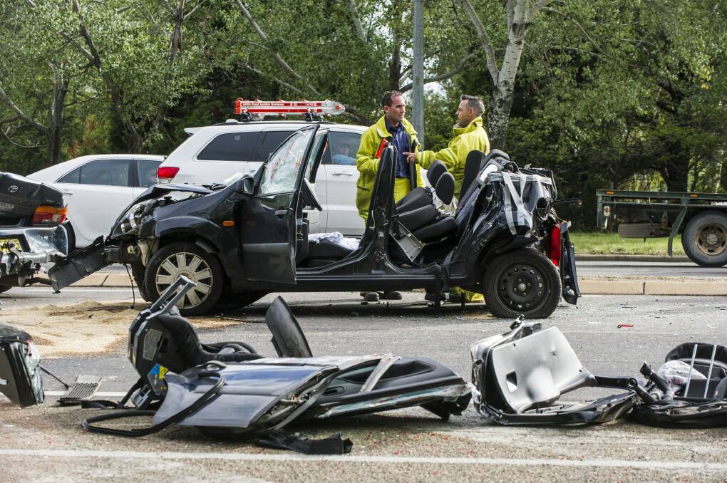 A woman was cut out of a car after the crash on Canberra Ave.