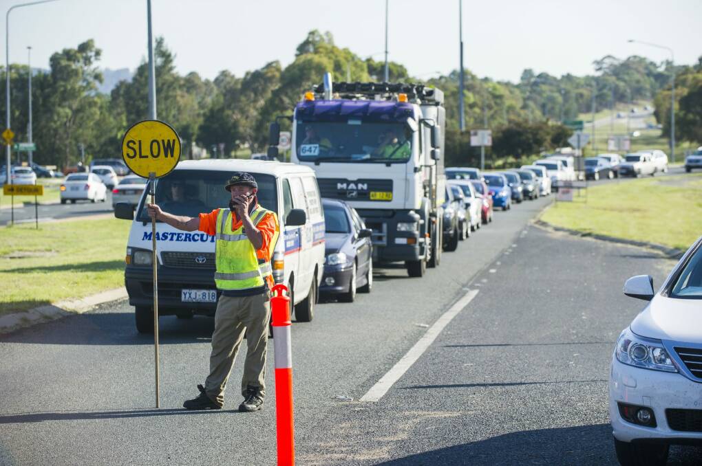 Southbound traffic on Woodcock Drive is stopped to allow extra northbound traffic though due to congestion caused by the Tharwa Drive closure. Photo: Rohan Thomson