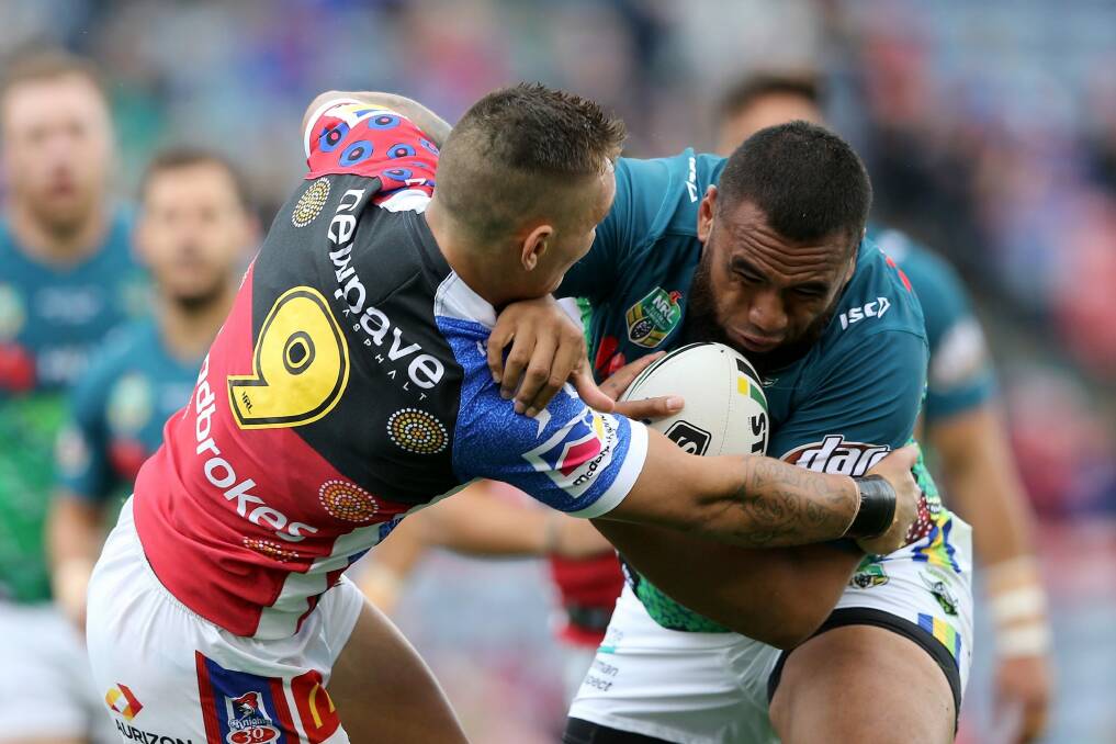 Junior Paulo of the Raiders is tackled by Danny Levi. Photo: Getty Images