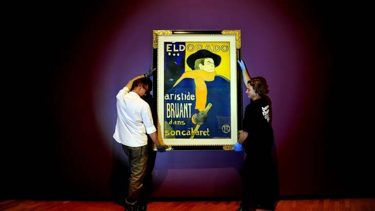 The poster boy of Paris ... One of the paintings from the Toulouse Lautrec exhibition being hung on Monday. Photo: Melissa Adams