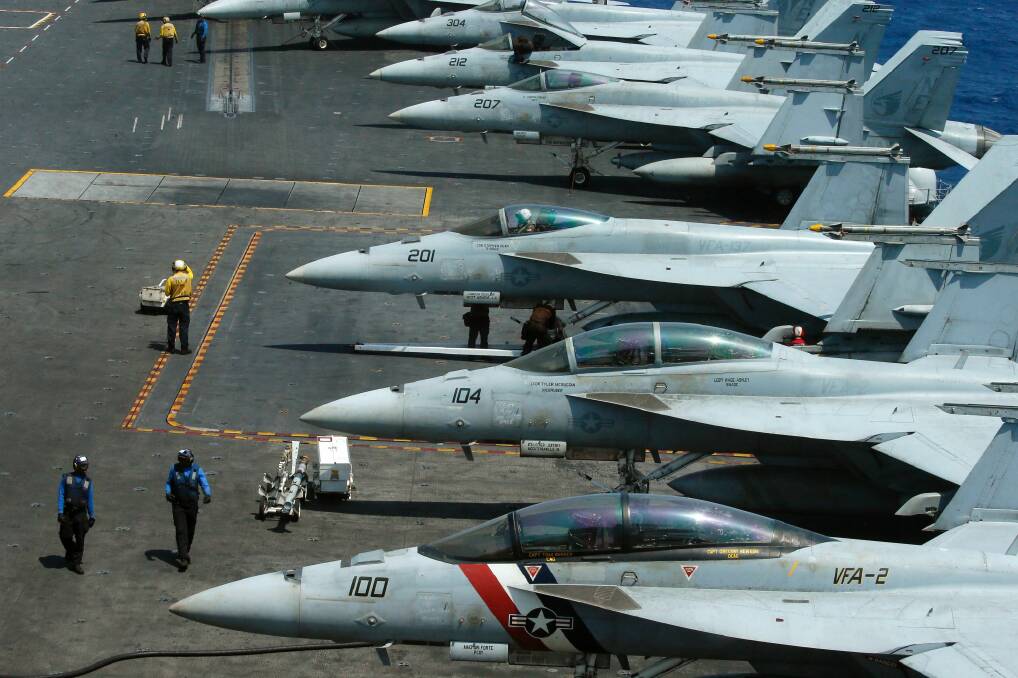 F18 fighter jets on the deck of the USS Carl Vinson. Photo: Bullit Marquez