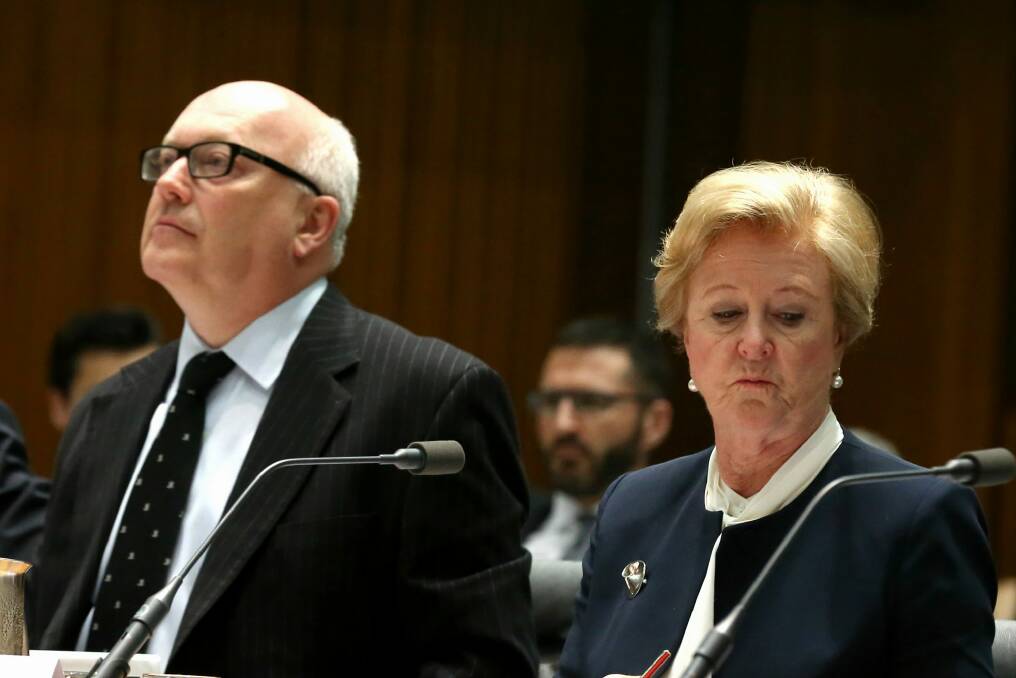 Unworkable: Attorney-General George Brandis and Professor Gillian Triggs appear before a parliamentary committee. Photo: Alex Ellinghausen