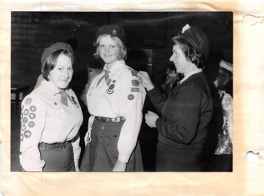 Jenny James receives her Queen's Guide badge in 1975 from Woden Valley Commissioner for Guides Shirley McLennan. Photo: Supplied