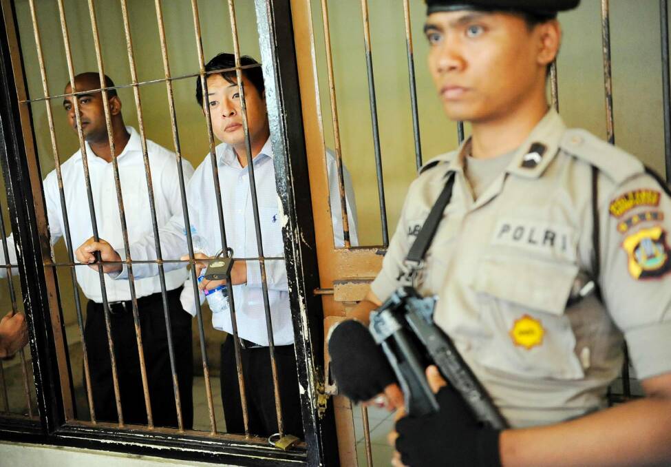 Sukumaran (left) and Chan behind bars. Photo: Antara Foto