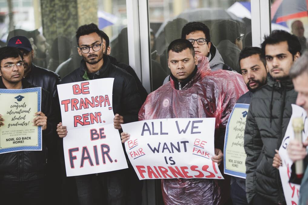 International students protest outside the Legislative Assembly against changes to the ACT government's visa program. Photo: Jamila Toderas
