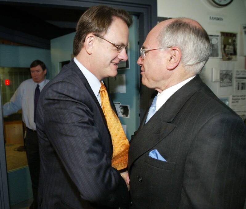 Opposition Leader Mark Latham giving then Prime Minister John Howard a power handshake during the 2004 election campaign. Which was, coincidentally, the closest he ever got to power. Photo: Penny Bradfield