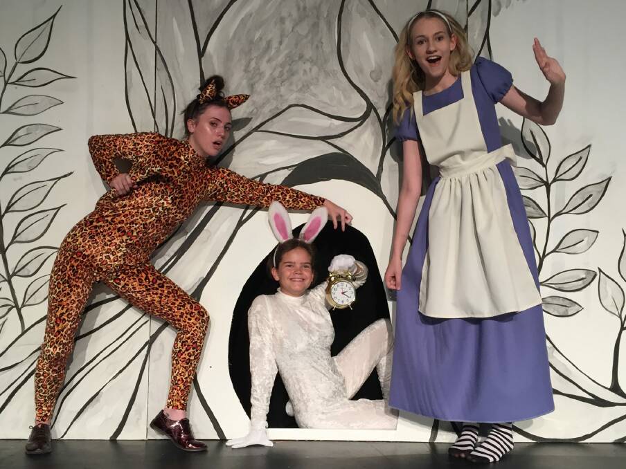 Nicole Carr as the Cheshire Cat, left, Jade Breen as the White Rabbit, Sarah O'Neill as Alice in Ickle Pickle's Alice in Wonderland. Photo: Supplied