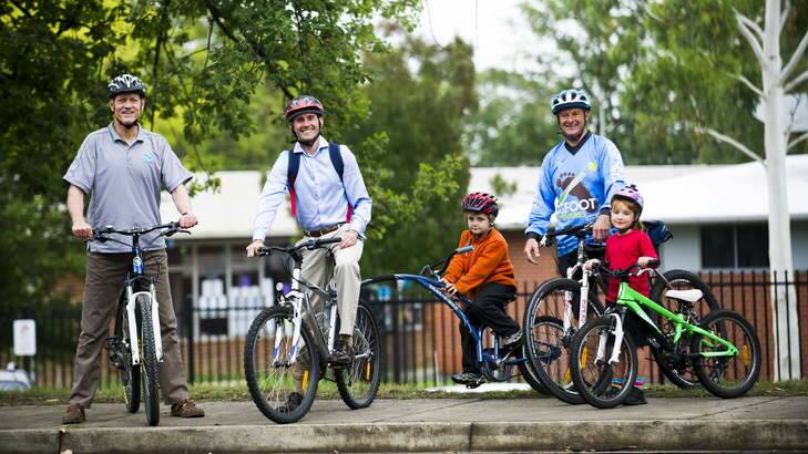 Peter Garrett, Andrew Leigh, Sebastian Leigh (6), Michael Milton and Matilda Milton (6) following their ride to Ainslie North PS to promote Ride2School day. Photo: Rohan Thomson