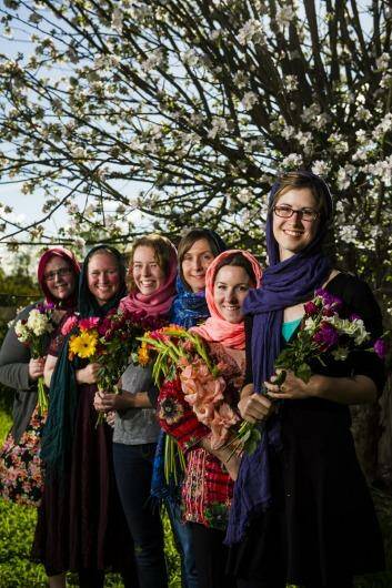 With love: Rebecca Bull, Kirrily Burnett, Eliza Spencer, Annabelle Lee, Gemma White and Hannah Dungan wore hijabs and gave out flowers at a Islamic service on weekend at a Muslim service. Photo: Jay Cronan