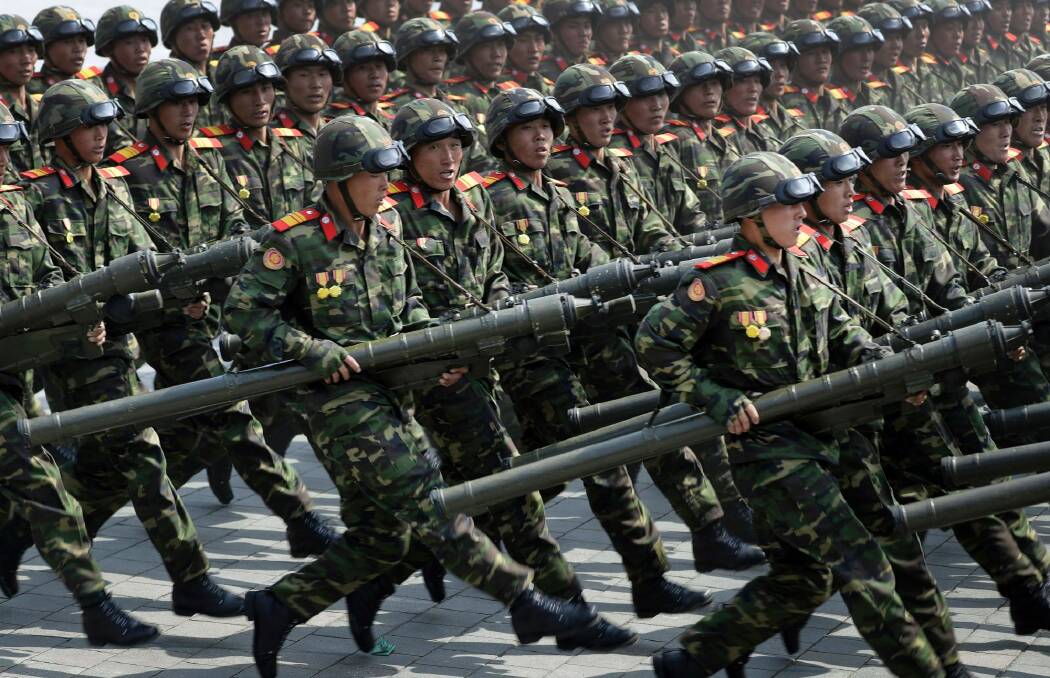 North Korean soldiers carrying rockets march during a military parade to celebrate the 105th birth anniversary of Kim Il-sung in Pyongyang. The country likes to celebrate anniversaries with shows of military might. Photo: Wong Maye-E