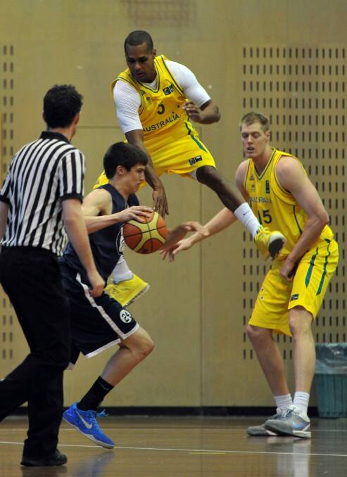NBA player Patty Mills in a Boomers' practice match at the AIS in 2013. Photo: Graham Tidy