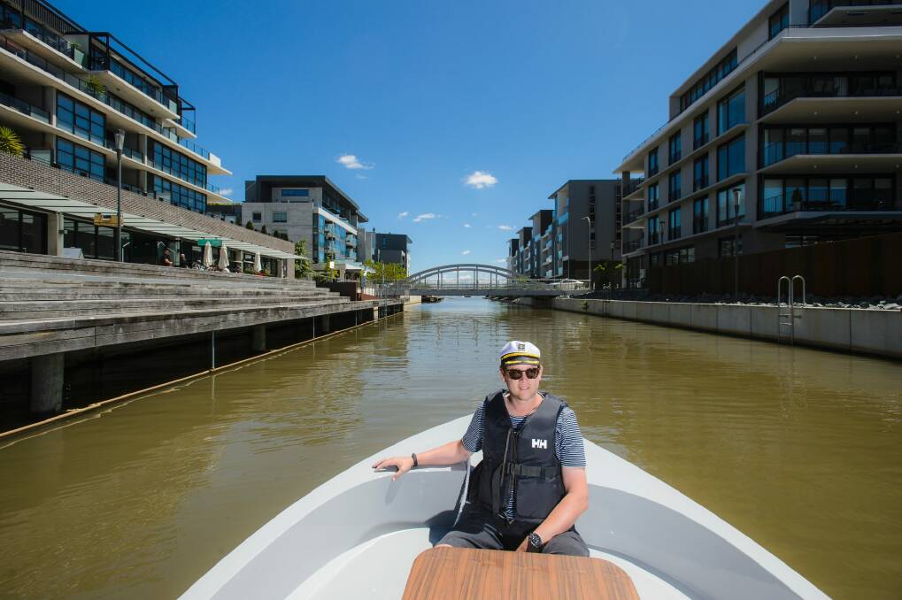 Go Boat Canberra owner Nick Tyrrell in one of the first two boats to arrive in Canberra. Photo: Sitthixay Ditthavong