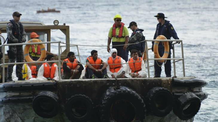 The HMAS Parramatta offloads on Christmas Island asylum seekers from Iraq, Iran and Pakistan after their boat capsized on Tuesday. Photo: Sharon Tisdale