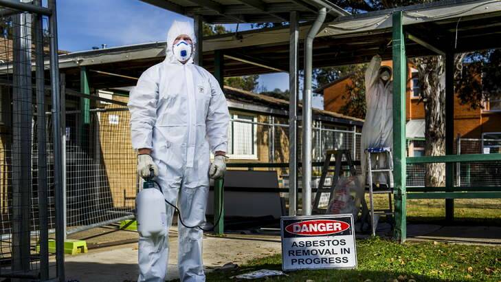 Removing asbestos from a local site. Photo: Rohan Thomson