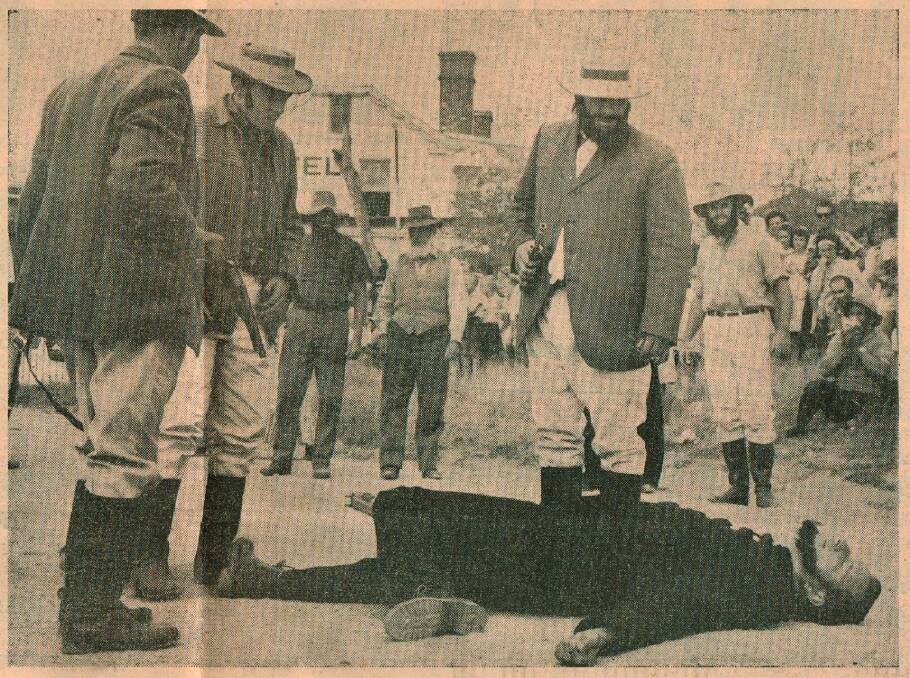 Scan of photo from <i>The Canberra Times</i> of the re-enactment at the 100th anniversary of the shooting of Constable Nelson (played by Edgar Penzig) by bushranger John Dunn (played by Chris Woodland) on January 26, 1965. (Photo: Courtesy Chris Woodland) 
 

Collector re-enactment 2 CT.jpg Photo: Chris Woodland