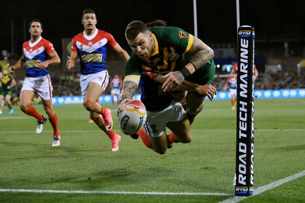 Josh Dugan scores for the Kangaroos against France at Canberra Stadium. Photo: AAP