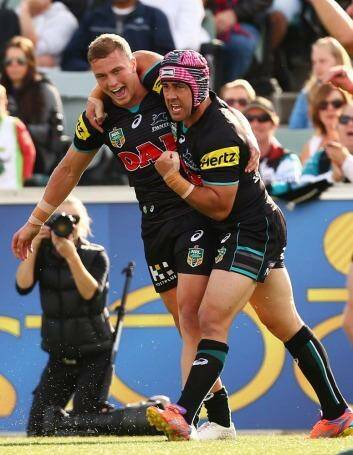 Matt Moylan and Jamie Soward celebrate a Panthers try. Photo: Getty Images