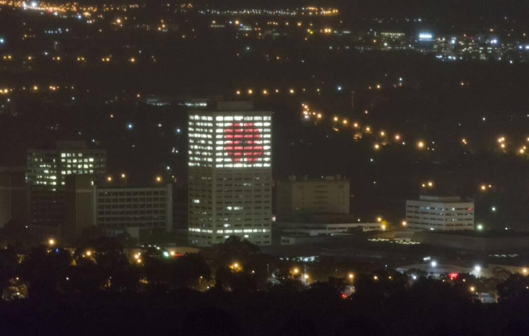 The poppy lit up in the Lovett Tower in Woden Photo: Supplied