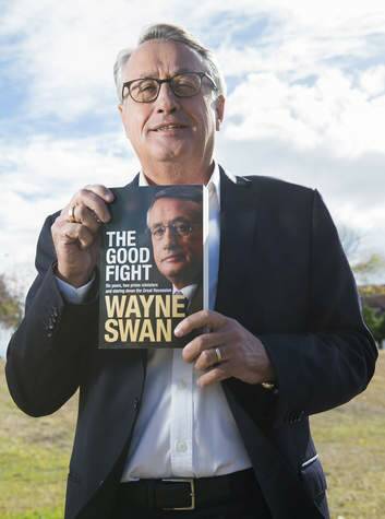 Wayne Swan poses near his offices in Nundah with a copy of his book, <i>The Good Fight</i>. Photo: Bradley Kanaris
