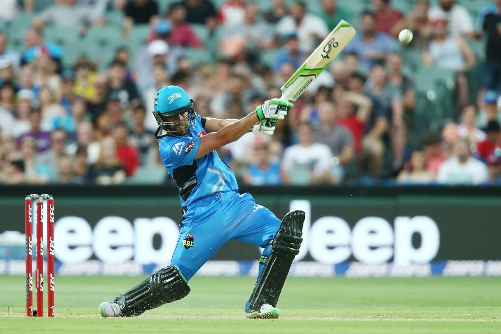 Alex Ross of the Adelaide Strikers slogs a delivery to the boundary during his innings of 65 against the Melbourne Stars. Photo: Getty Images