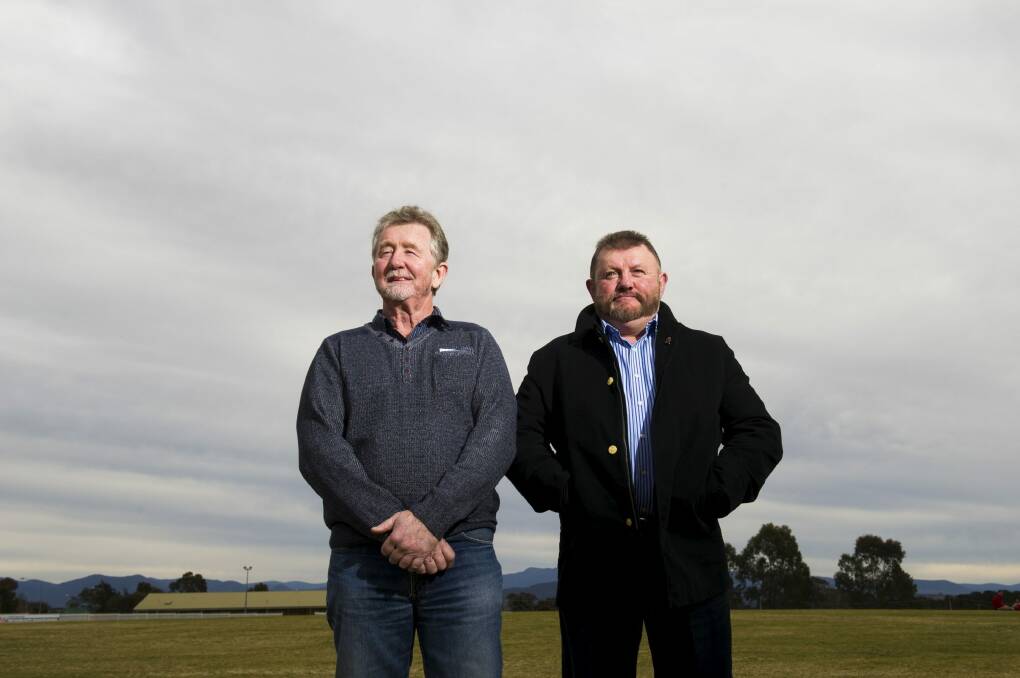 Gilmore neighbours Colin O'Hare and Jim Bodsworth have been recognised for their bravery in apprehending an armed offender during a violent brawl in their street.  Photo: Rohan Thompson