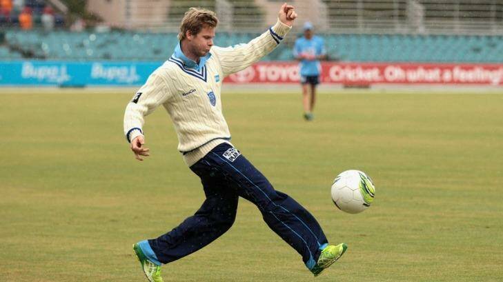 Blues player Steve Smith plays some soccer during the rain delay on day four.