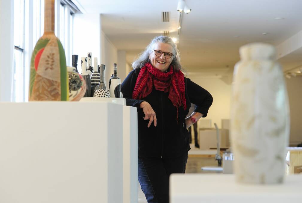 Ceramic artist Janet DeBoos with some of her pieces at Craft ACT. Photo: Melissa Adams