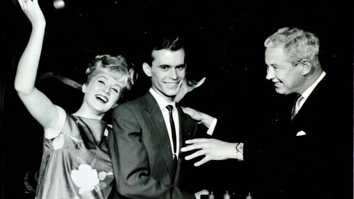 Melbourne September 1963- Mario Despoja with Beverley Robbins, hostess and Roland Strong, producer-compere of Coles 3000 Pound question. Photo: Supplied