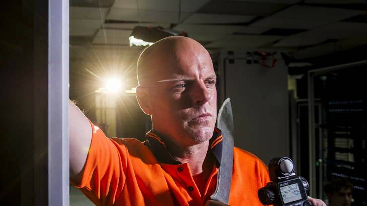 Greg Fleet wields a rather large, scary-looking knife on the set of Canberra movie <em>Me and My Mates vs the Zombie Apocalypse</em>. Photo: Rohan Thomson