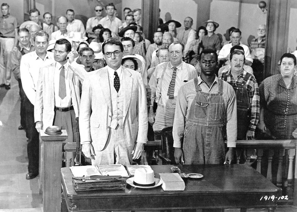  Gregory Peck, foreground left, and Brock Peters, foreground right, in a scene from the 1962 film <i>To Kill a Mockingbird</i>. Photo: AP