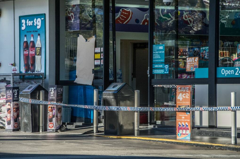 The Caltex service station where an employee was fatally stabbed remained cordoned off on Friday morning. Photo: Karleen Minney