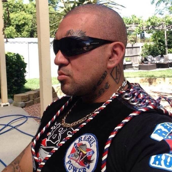 Bikie Alex Bourne, formerly of the Rebels, now Comanchero, with the "1%" tattoo on his neck. Photo: Supplied